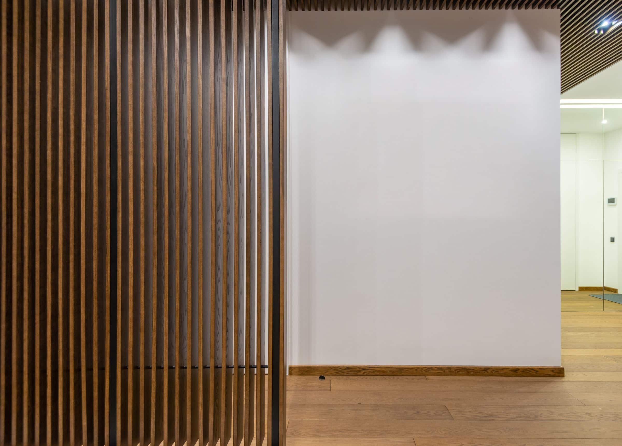 Wooden slat wall panels in a minimal interior