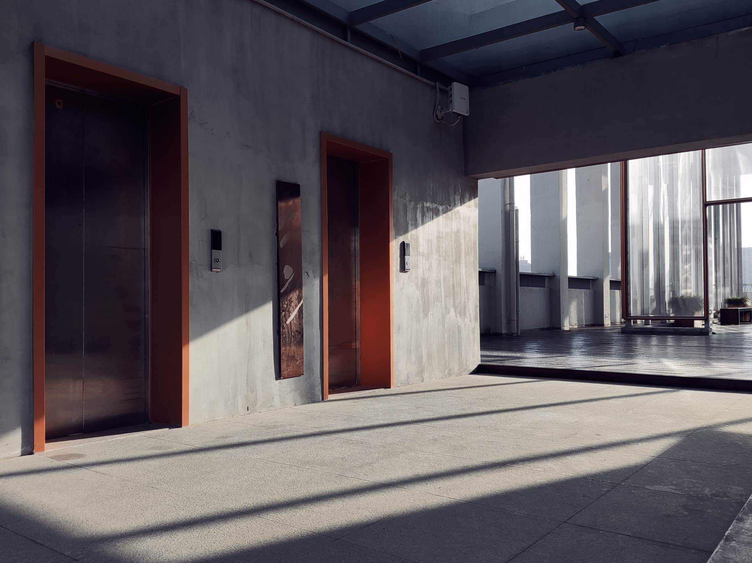 Sunlit architectural interior with strong linear shadows