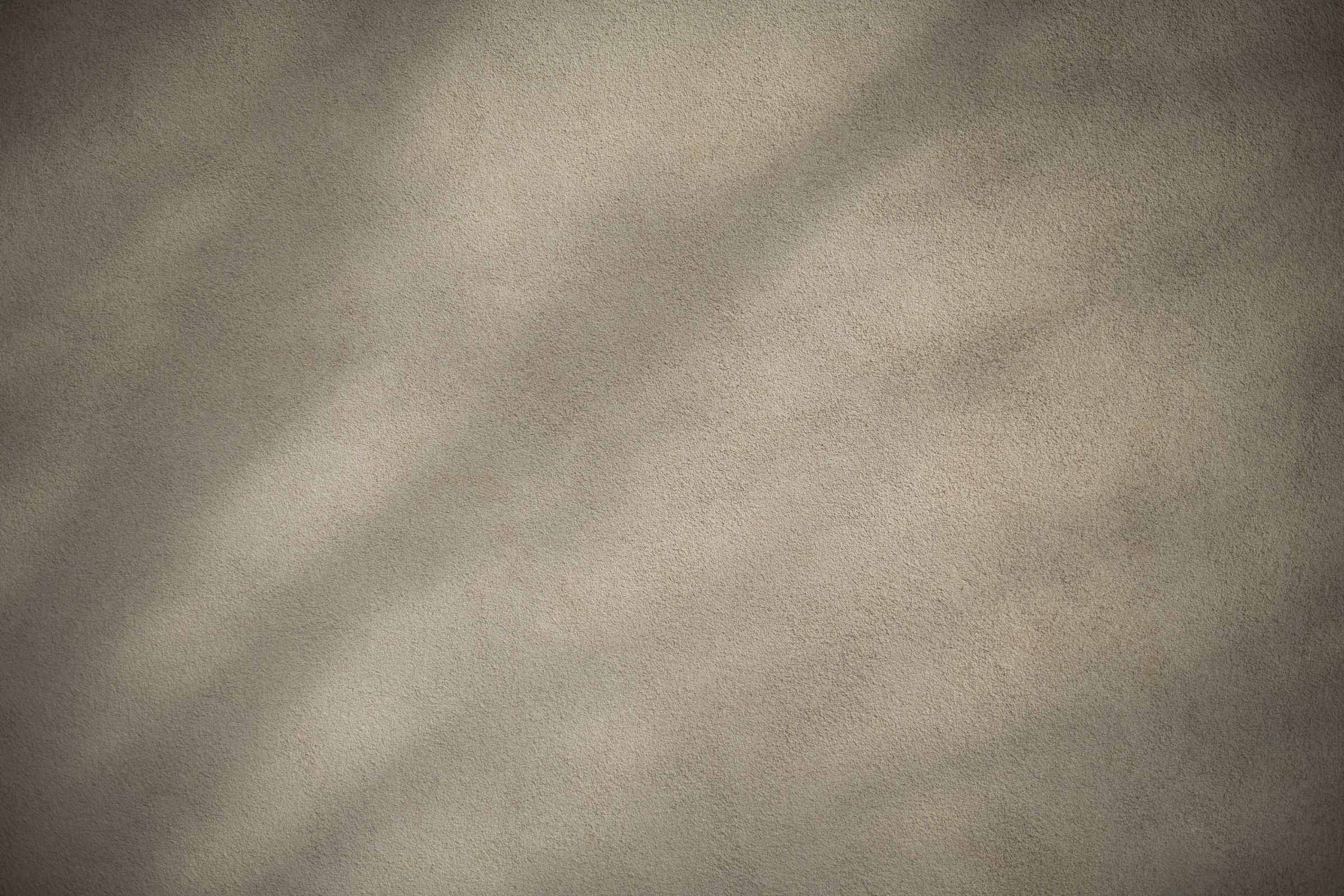 Soft light and shadow across a textured plaster wall