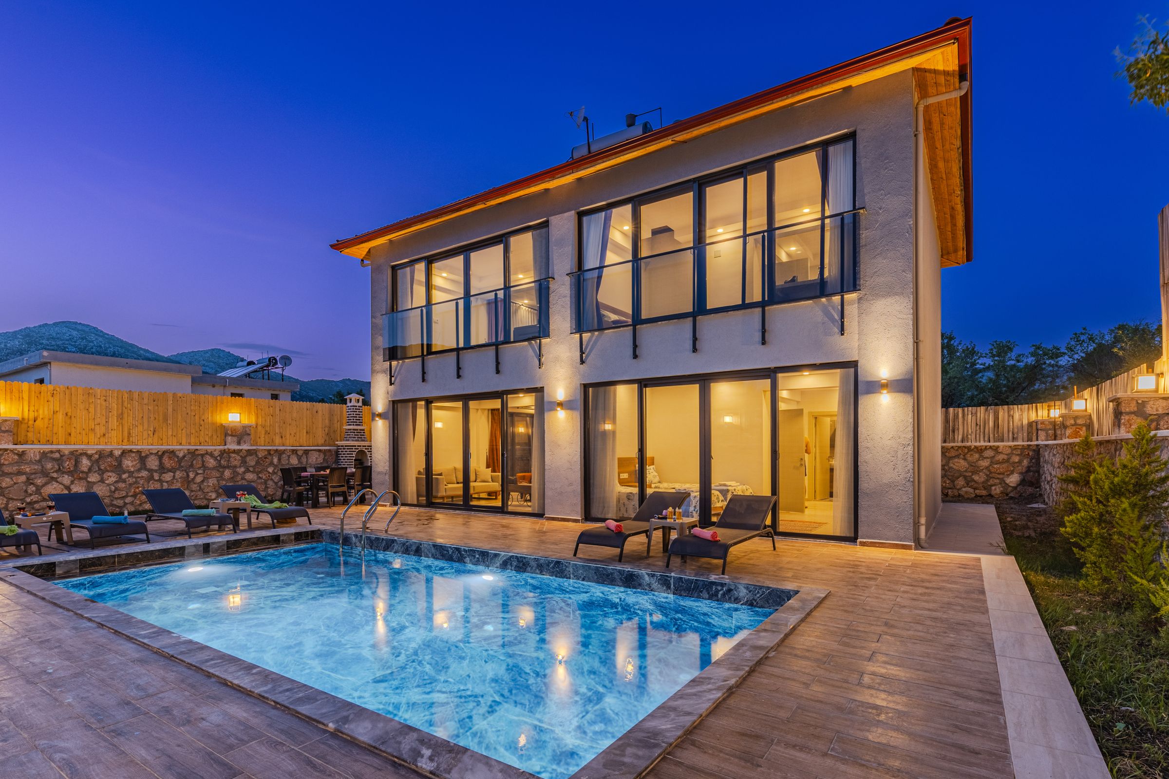 Contemporary residence with a reflecting pool at dusk