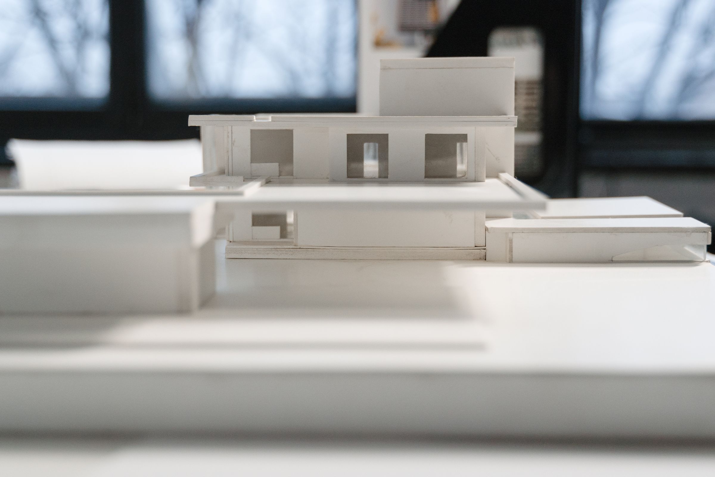 White architectural scale model under soft studio light