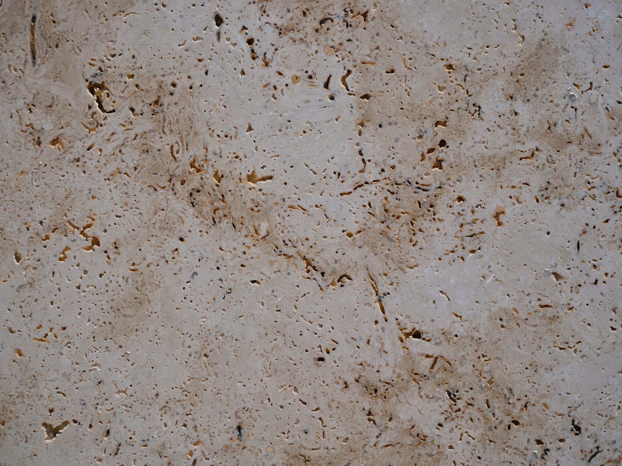 Warm stone surface with natural veining