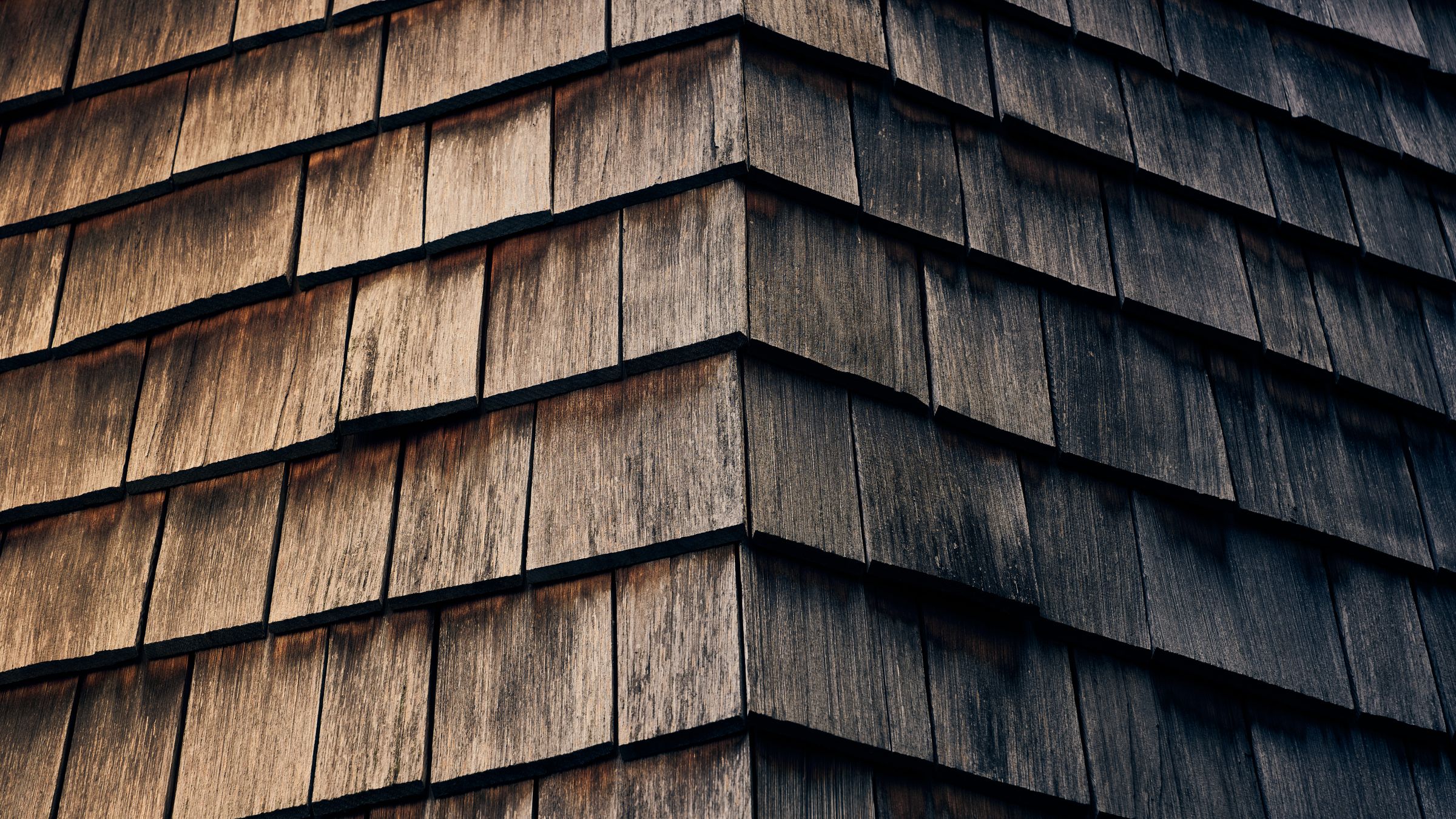 Weathered timber shingle surface with layered grain