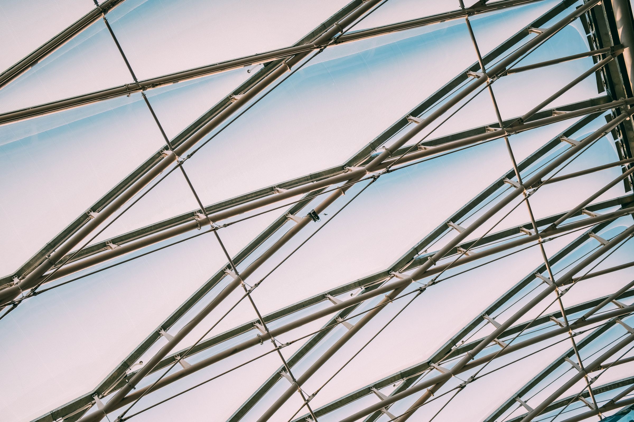 Steel and glass structural detail viewed from below