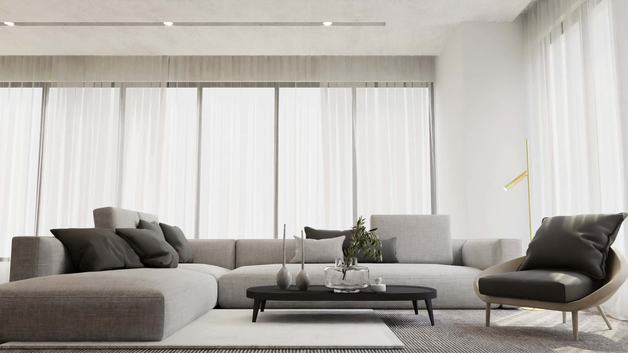Bright contemporary living room with warm wood flooring and minimal furnishings